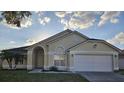 Inviting single-Gathering home boasting a well-maintained lawn and attached garage at 231 Old Mill Cir, Kissimmee, FL 34746