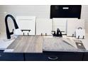 Samples of home design, including a faucet, various tiles, carpet, and cabinet doors at 3749 Deer Ridge Dr, Mount Dora, FL 32757