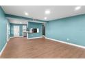 Spacious living area with light blue walls, modern flooring, and natural light at 4217 Park Lake St, Orlando, FL 32803