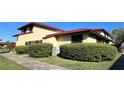 Charming exterior view of a well-maintained home with verdant landscaping at 433 Hunter Circle Cir, Kissimmee, FL 34758