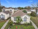 An aerial view of single-Gathering homes in a well-maintained residential neighborhood at 734 Olympic Cir # 30, Ocoee, FL 34761