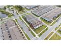Aerial view of townhomes showcasing the property layout, landscaping, and neighborhood at 10414 Folly Beach Rd, Orlando, FL 32827