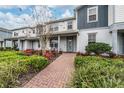 Charming two-story townhome with a welcoming front porch and well-maintained landscaping at 10414 Folly Beach Rd, Orlando, FL 32827