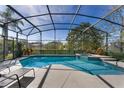 Relaxing screened-in pool with a jacuzzi and plenty of space to lounge and entertain outdoors at 141 Prestwick Dr, Davenport, FL 33897