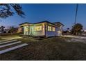 A well-maintained home with a modern design and a neatly kept lawn and driveway at 2061 S Peninsula Dr, Daytona Beach, FL 32118