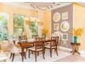Inviting dining room with coffered ceilings, stylish light fixture, and neutral decor at 3100 Stonewyck St, Orlando, FL 32824