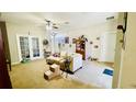 Spacious living room features neutral walls, carpet flooring, and natural light at 419 Cierra Oaks Cir, Lady Lake, FL 32159