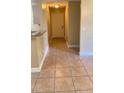 Tiled entryway featuring neutral paint, granite counters and a smooth transition to the rest of the home at 709 Secret Harbor Ln # 213, Lake Mary, FL 32746