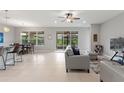 Spacious living area with tile flooring, neutral paint and a view of the screened patio at 1264 Bonita Canyon Dr, Kissimmee, FL 34759