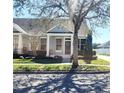 Charming single-story home with a welcoming front porch, nestled in a serene neighborhood at 14620 Golden Rain Tree Blvd, Orlando, FL 32828