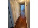 Hallway with hardwood floors and a closet to the left at 2019 Dixie Belle Dr # 2019L, Orlando, FL 32812