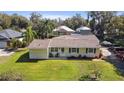 Charming single-story home with a well-maintained lawn and inviting curb appeal at 401 Woodlawn Ter, Kissimmee, FL 34744
