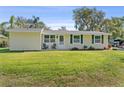 Charming single-story home with a well-maintained lawn and inviting curb appeal at 401 Woodlawn Ter, Kissimmee, FL 34744