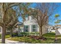 Charming two-story home with gray shutters and well-maintained landscaping at 6054 Roseate Spoonbill Dr, Windermere, FL 34786