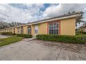 Street view of single-story homes featuring manicured front bushes and a walkway to the front doors at 635 Lake Marion Golf Resort, Kissimmee, FL 34759