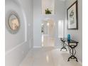 Elegant foyer featuring tile flooring and stylish decor at 8122 Yellow Crane Dr, Kissimmee, FL 34747