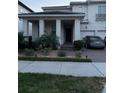 Charming two-story home with a well-maintained lawn, two-car garage, and brick paved driveway at 8289 Topsail Pl, Winter Garden, FL 34787