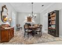 Elegant dining room featuring a round table, chandelier, and decorative accents at 1154 Celebration Ave, Celebration, FL 34747