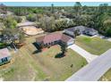 Inviting single-Gathering home featuring a well-maintained lawn, fenced yard, long driveway, and a two-car garage at 15069 Sw 29Th Avenue Rd, Ocala, FL 34473