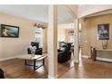 Comfortable living room with a neutral color palette and an open layout to the dining area at 2020 Windcrest Lake Cir, Orlando, FL 32824