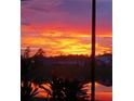 Captivating sunset view over the lake, showcasing vibrant colors and tranquil surroundings at 2941 Marlberry Ln, Clermont, FL 34714