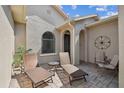 Open patio with seating, pavers and decor at 3384 Fallbrook Dr, Poinciana, FL 34759