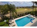 Enjoy the sun at this pool and hot tub overlooking the beautiful golf course at 361 Muirfield Loop, Reunion, FL 34747