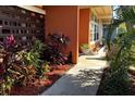 Close up view of a landscaped walkway leading up to the home's front entrance at 5019 Saint Germain Ave, Orlando, FL 32812