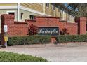 A brick community sign reads Battaglia at 521 Pacito Way, St Cloud, FL 34769