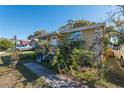 Street view of a cozy home with a well-kept lawn and welcoming entrance at 615 N Emory Ave, Kissimmee, FL 34741