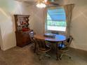 Classic dining room featuring an oval table, chairs, and a china cabinet with natural light at 706 Francis St, Kissimmee, FL 34741