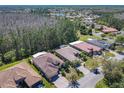 Real estate aerial showing neighborhood featuring well-maintained homes with manicured lawns at 741 Villa Park Rd, Poinciana, FL 34759