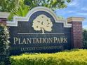 Elegant Plantation Park sign indicating 'Luxury Condominiums' surrounded by manicured landscaping at 8300 Elm Park Dr # 7110, Orlando, FL 32821