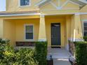 Inviting front porch with stone accents and lush landscaping at 1000 Seburn Rd, Apopka, FL 32703