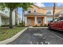 Attractive townhome with a front lawn and parking space for easy access at 1717 Retreat Cir, Clermont, FL 34714