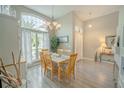 Bright dining room features a large window, neutral paint colors, and light wood-look floors at 4809 Jeanette Ct, St Cloud, FL 34771