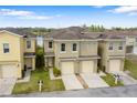 Aerial view of townhomes with lake views at 486 Lake Shore Pkwy, Davenport, FL 33896