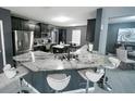 Gourmet kitchen features granite countertops, stainless steel appliances, and a breakfast bar at 5640 Silver Thistle Ln, St Cloud, FL 34772