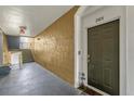 Condo hallway with door to unit 205, bench seating, and stairs at 8103 Coconut Palm Way # 204, Kissimmee, FL 34747