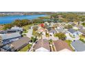 Aerial view of the community highlighting the home's proximity to a lake and surrounding neighborhood at 919 Lake Charles Dr, Davenport, FL 33837