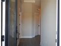 Inviting hallway with neutral walls and wood-look floors at 1359 Greenfield Loop, Kissimmee, FL 34747