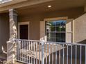 Cozy front porch area with a white railing, offering a welcoming entrance to the home at 15129 Driftwood Bend St, Winter Garden, FL 34787