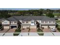 Charming townhomes with brick-paved driveways, well-maintained landscaping, and neutral exteriors create an inviting curb appeal at 1737 Kato Way, Kissimmee, FL 34744