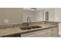 Close up of kitchen island and granite countertop at 429 Lark Ct, Poinciana, FL 34759