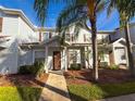 Well-maintained townhome with a cozy entrance and mature landscaping at 5364 Diplomat Ct # 106, Kissimmee, FL 34746