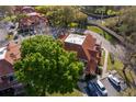 Aerial view of townhomes showcasing red tile roofs, landscaping, and convenient parking at 8507 Waterview Way, Winter Haven, FL 33884