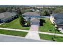 An exterior elevation displays the home's architecture and well-manicured front lawn at 1336 Lattimore Dr, Clermont, FL 34711