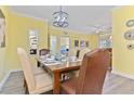 Inviting dining room with a wooden table set for a meal, complemented by stylish decor at 1370 Tuscana Ln # 5406, Davenport, FL 33896