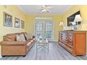 Cozy living room featuring a comfortable leather sofa and elegant furnishings at 1370 Tuscana Ln # 5406, Davenport, FL 33896