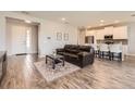 Inviting open-concept living room featuring wood floors and bright natural light at 2372 Sirena Ln, Mount Dora, FL 32757